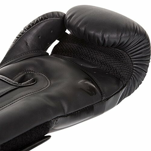 Black boxing glove on white background