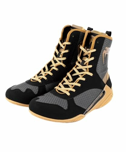 Black and gold boxing shoes with high-top design.