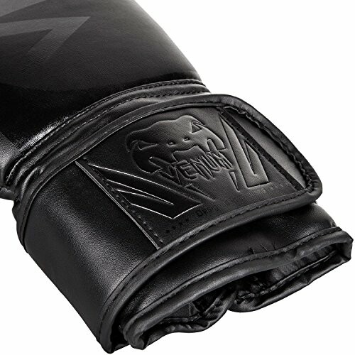 Black Venum boxing glove with logo