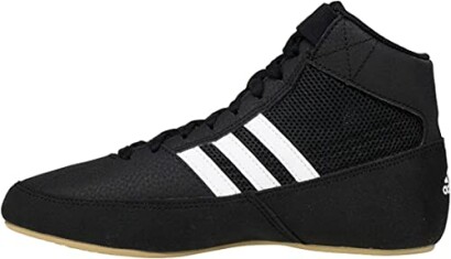 Black wrestling shoe with white stripes and gum sole.