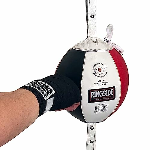 Hand in glove hitting a Ringside boxing speed bag.