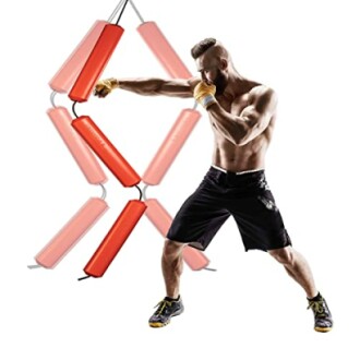 Man practicing boxing with a vertical punching bag setup.