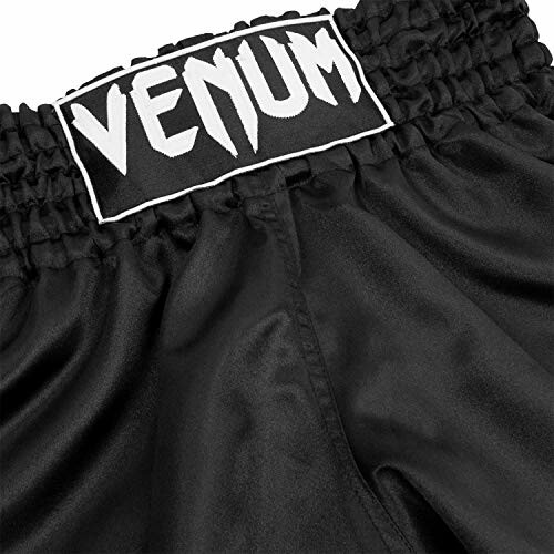 Close-up of black Venum boxing shorts with logo